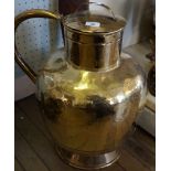 A stylish 19th Century brass jug of bulbous form.