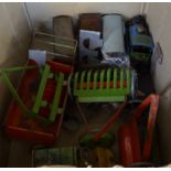 A mixed lot of assorted tinplate trains, tractors and equipment.