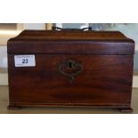 A George III mahogany tea caddy raised on four bracket feet.