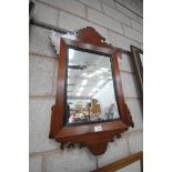 A Mahogany Chippendale style wall mirror.