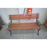 A Painted iron and slatted hardwood garden bench.