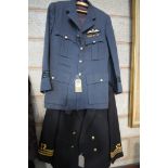 An RAF tunic and a Naval officers tunic.