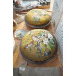 A Pair of Victorian berlin work circular footstools each depicting birds amongst flowering branches.