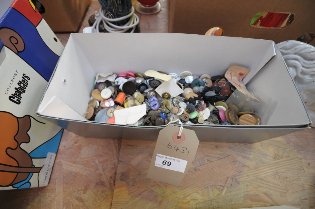A Collection of vintage buttons to a box.