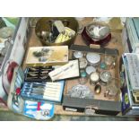 Assorted metal ware including a brass skellet, loose cutlery , dressing table jars, cased cutlery,