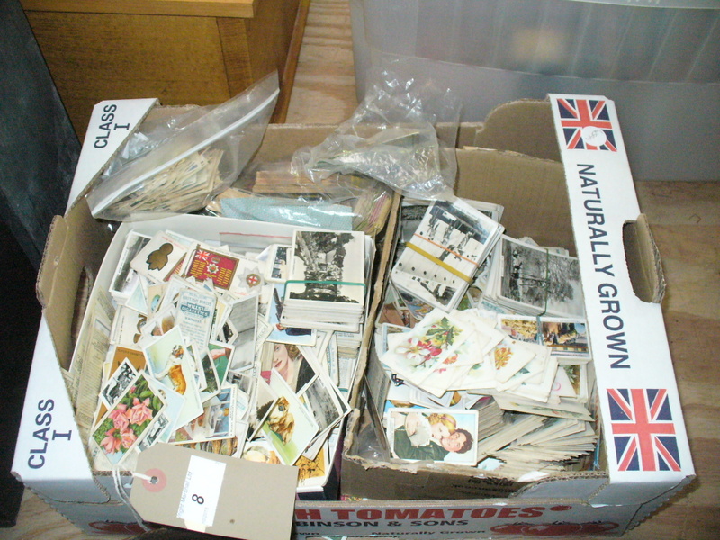 A Collection of cigarette cards to a box.