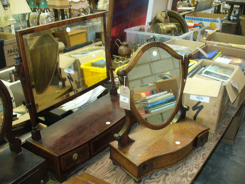 A 19th century inlaid mahogany dressing table mirror with a bow front 3 drawer plinth and an oak