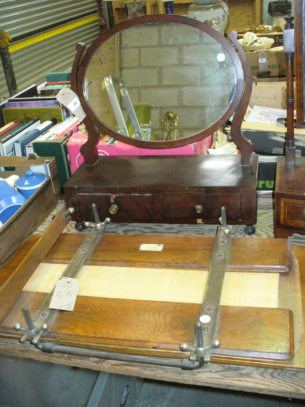 A 19th Mahogany oval dressing table mirror and a vintage Rowan flower press.