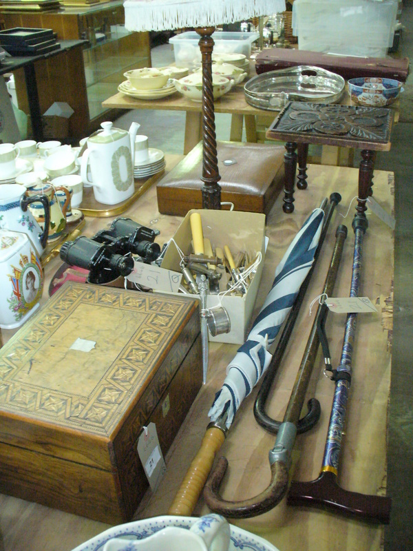 A Victorian parquetry box, cased binoculars, loose cutlery, pewter chamber stick, walking sticks,