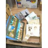 A Large collection of loose vintage postcards and a postcard album.