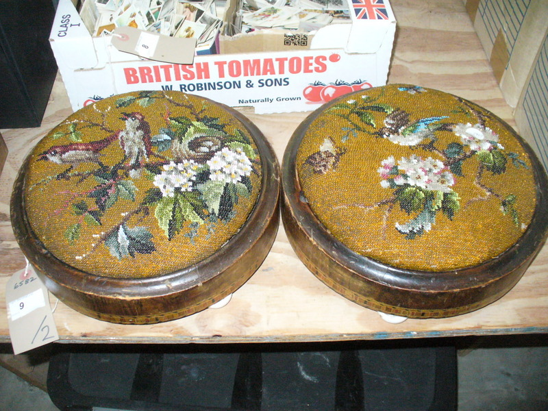 A Pair of Victorian berlin work circular footstools each depicting birds amongst flowering branches.