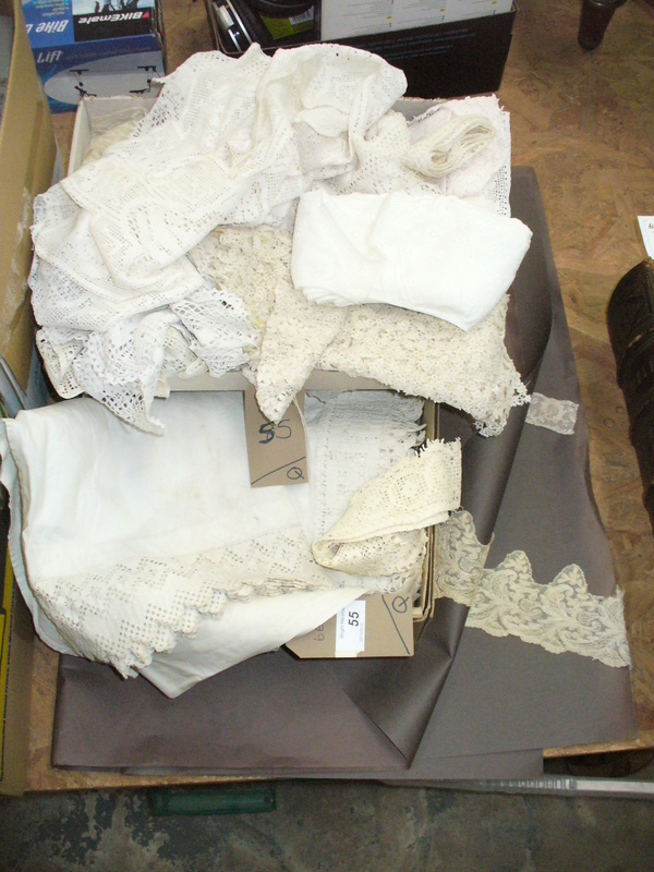 A Collection  of vintage lace to a folder and a box and a collection of crocheted items.