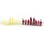 A Chinese carved ivory chess set, early 20th Century Each of the pieces carved in the form of a