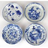 A collection of four 18th Century and later saucer dishes Each of circular form, painted in rich