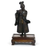 A Japanese bronze and parcel gilt figure of lady Shakuhachi (flute) player, in the manner of Miyao