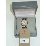 A Boxed Dunhill gold coloured wristwatch with leather strap.