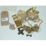 A Bag of assorted costume jewellery , gold coloured bracelets, beaded necklaces , etc.