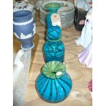 A Mdina coloured glass cylindrical vase, a Mdina decanter and stopper and a bulbous vase.