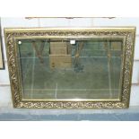 An Ornate gilt framed rectangular wall mirror.