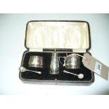 A Cased three piece silver cruet set c/w spoons, Birmingham 1926.