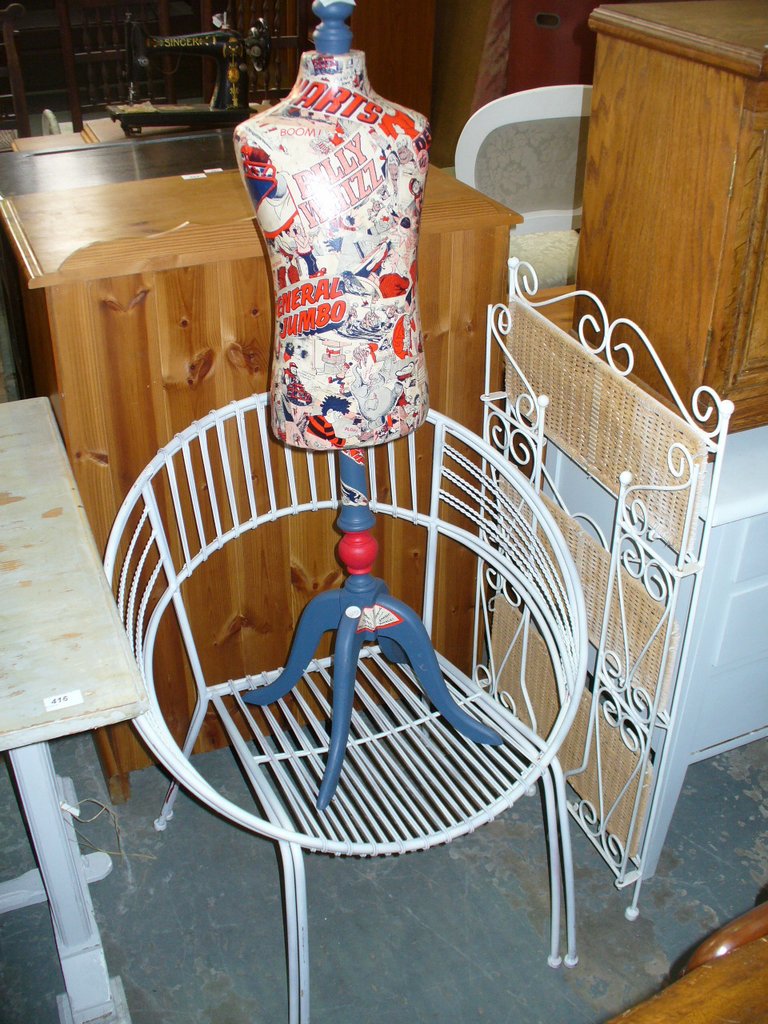 A Painted iron and wicker folding book shelf, 2 painted iron tub chairs and a tailors dummy.