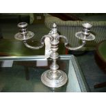 A Silver 2 branch table candelabra raised on a knopped stem with a circular plinth,