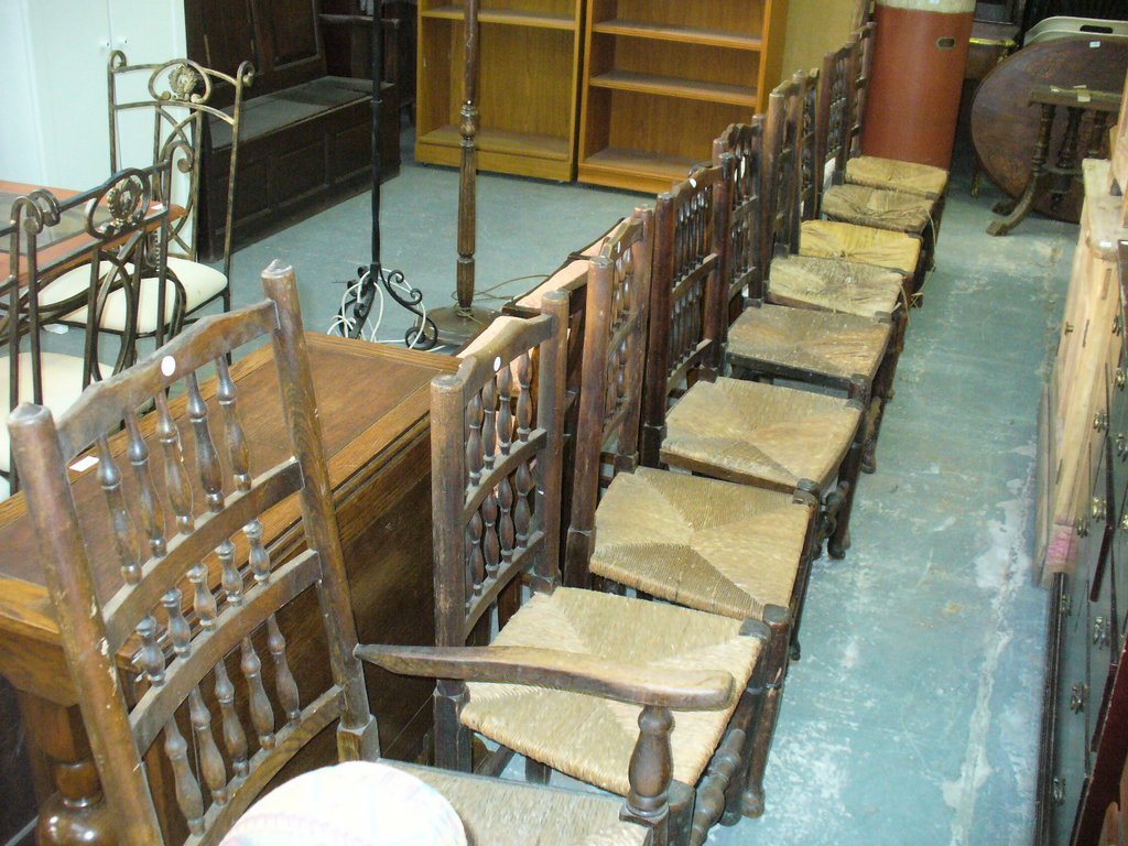 9 Assorted spindle back rush seated country chairs.