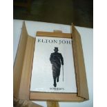 A Boxed Elton John Sothebys catalogue.