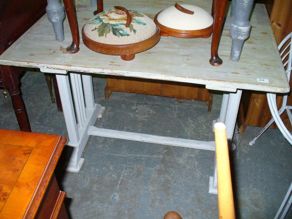 A Shabby chic painted pine rectangular kitchen table.