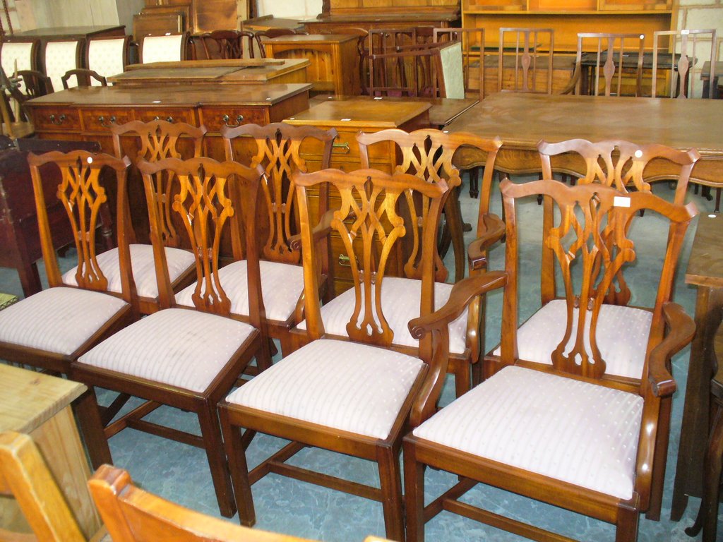 A Set of 8 mahogany Chippendale style dining chairs with interlaced splat backs.