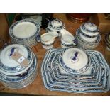 A Corona Ware " Lotus" pattern part dinner service including graduated meat plates,