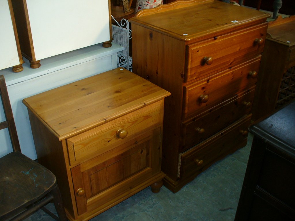 A Modern pine 5 drawer chest and a pine side cabinet.