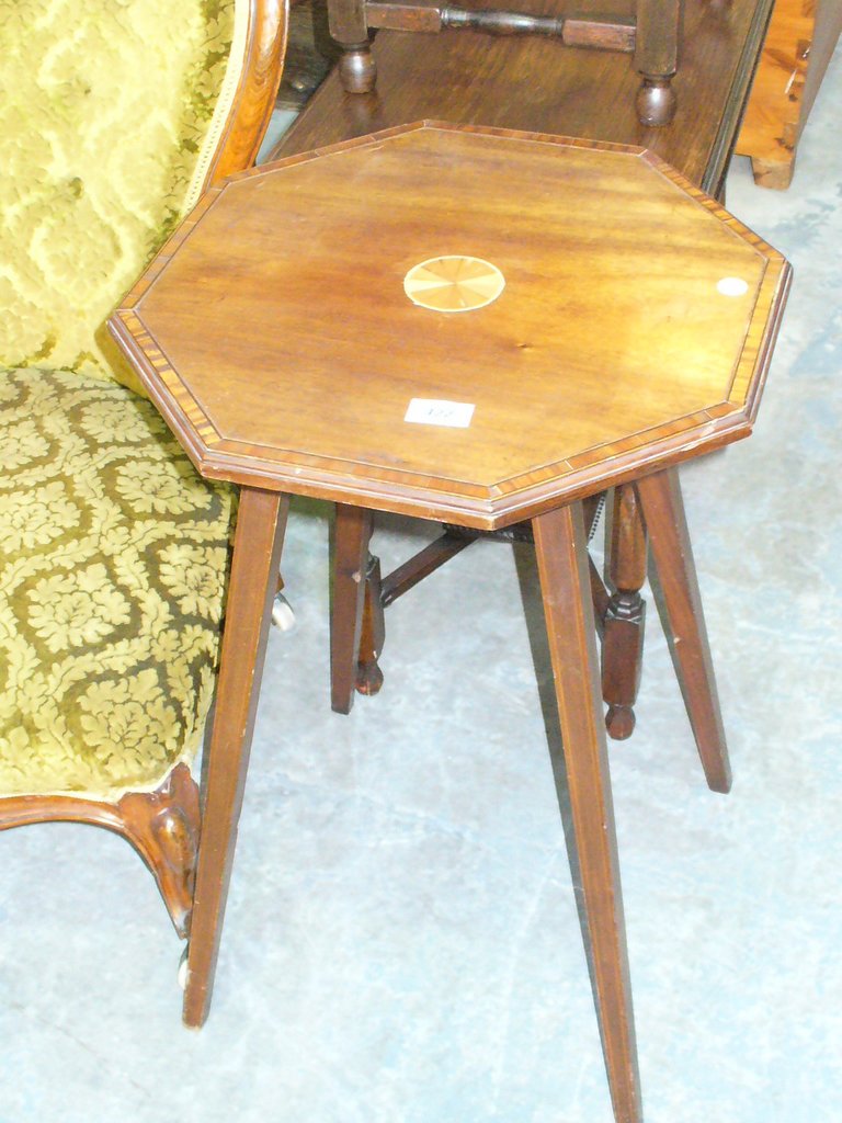 An Edwardian inlaid mahogany octagonal occasional table.