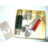 A Victorian green glass double ended silver capped scent bottle, a red glass example,