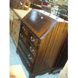 A Reproduction mahogany Georgian style bureau with a fall front above 4 long drawers.