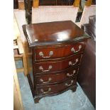 A Reproduction mahogany serpentine chest of 4 drawers, small proportions.
