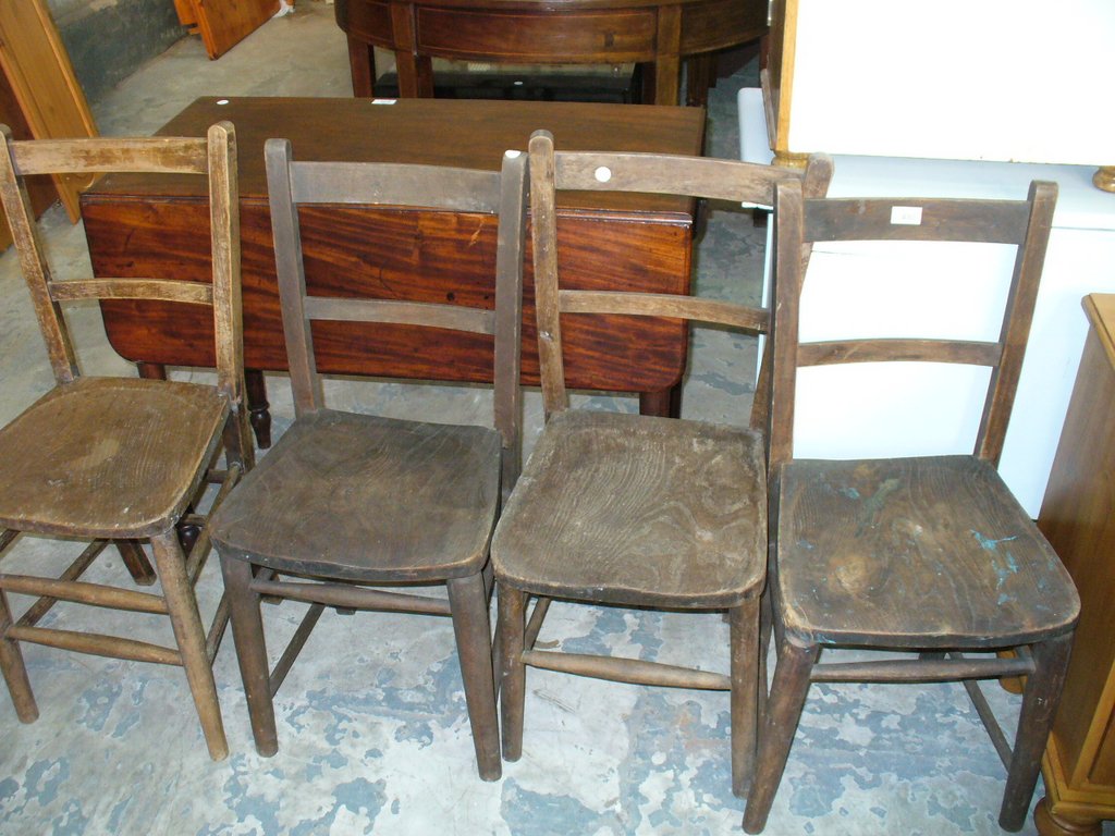 4 Early 20th century elm seated school or chapel chairs.