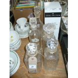 6 Assorted glass decanters including a bottle shaped  and mallet shaped examples.