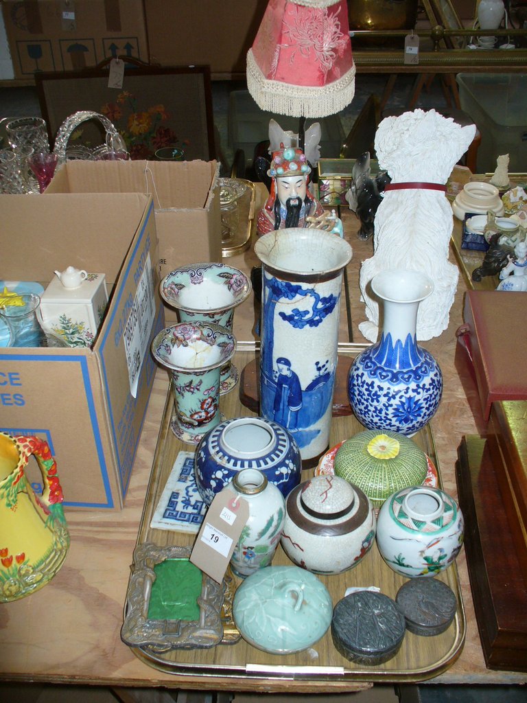 A Tray of oriental wares including figural table lamp, Chinese blue and white cylindrical vase,