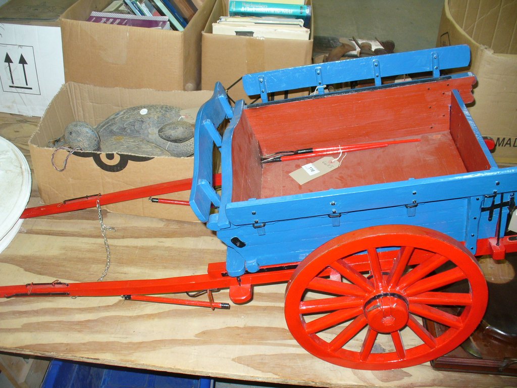 A Scratch built painted wooden model of a horse drawn 2 wheel farm cart c/w miniature fork and rake.