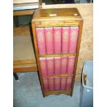 A Collection of Dickens works to an oak open bookcase.