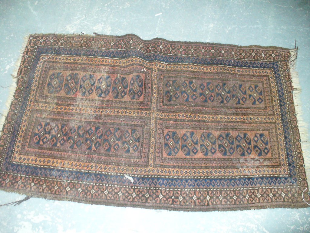 A Persian pattern rug in shades of blue and brown.