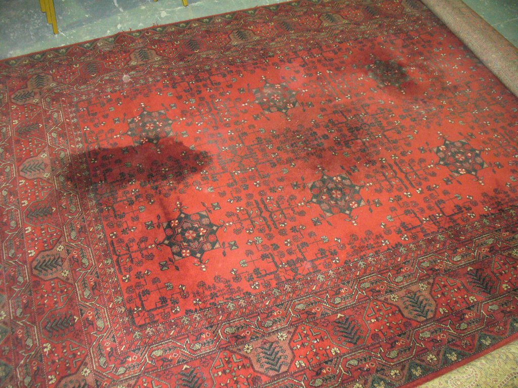 A Royal Kushan Persian pattern rug red ground.