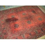 A Royal Kushan Persian pattern rug red ground.
