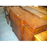 A Reproduction yew wood break front sideboard.