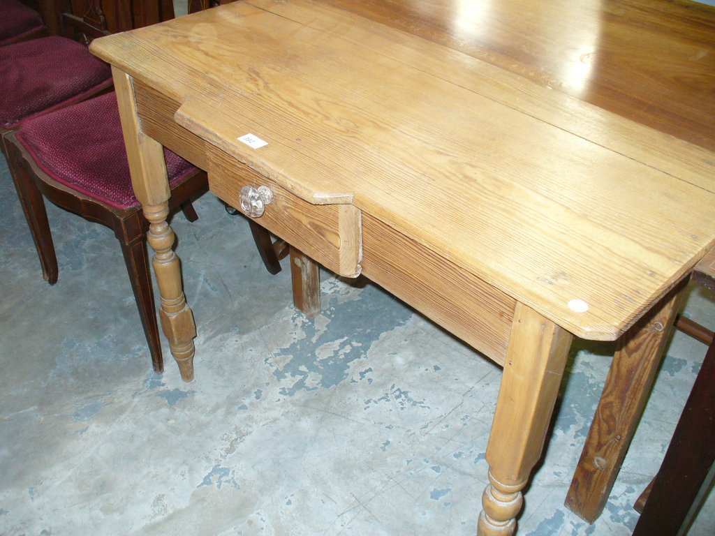 A Victorian pitch pine single drawer side table.