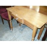 A Victorian pitch pine single drawer side table.