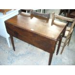 A 19th Century mahogany Pembroke table with a single frieze drawer raised on ring turned supoorts.
