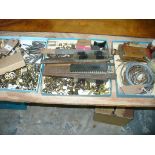 A Collection of watch and clock parts , brass cogs and fittings, qty to 3 trays.