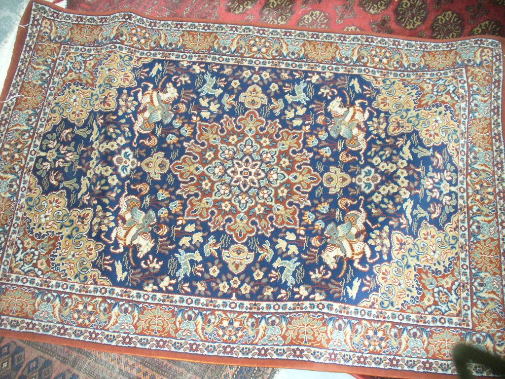 A Rami Persian pattern rug blue ground.